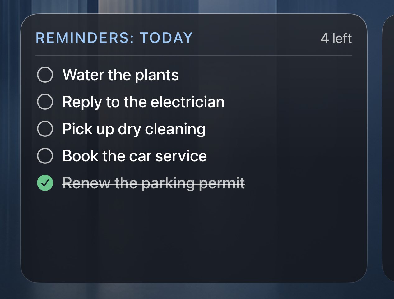 The To-Do card on the Glass theme, showing a reminders list with one item checked off